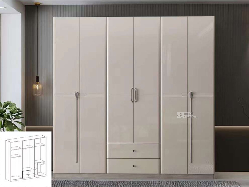 Tủ quần áo 6 cánh hiện đại, chụp chính diện trong không gian phòng ngủ tối giản. Tủ có bề mặt phẳng, màu be sáng bóng, với…