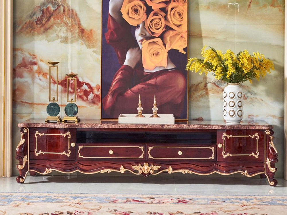 Kệ tivi tân cổ điển KTA20-24 màu nâu nho, chụp chính diện trong không gian phòng khách sang trọng. Kệ có mặt đá nhân tạo m…