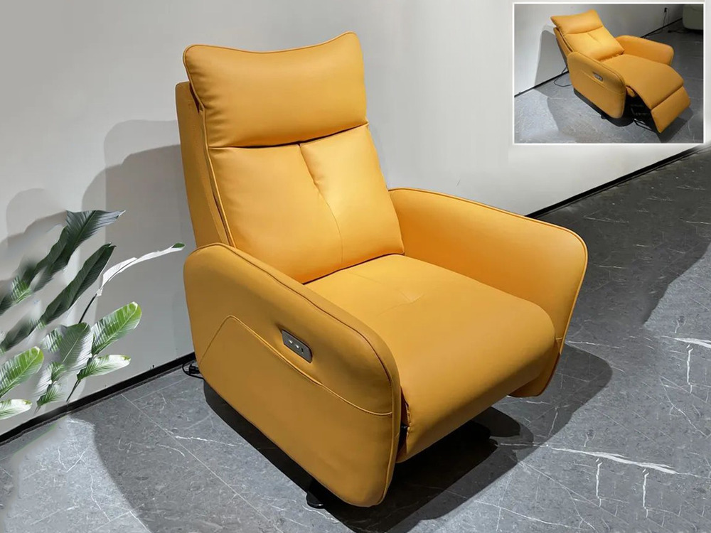 Ghế thư giãn điện E63 màu vàng cam nổi bật, chụp từ góc hơi cao, đặt trên sàn gạch xám đậm. Ghế có thiết kế hiện đại với n…