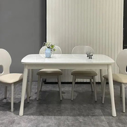 Bộ bàn ăn 1m4 mặt đá PL2316-14 được chụp chính diện trong không gian phòng ăn hiện đại. Bàn ăn hình chữ nhật bo tròn góc…