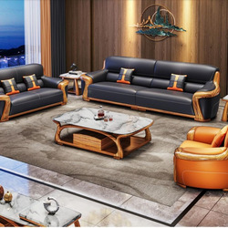 Toàn cảnh bộ sofa gỗ mun SBF623-124 màu đen và cam, gồm một băng dài, một băng đôi, một ghế đơn, bàn trà mặt đá và hai bàn…