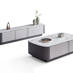 Bộ bàn trà và kệ tivi BTK6101-14KT được chụp từ góc chếch phía trước, nổi bật trên nền trắng. Bàn trà hình chữ nhật bo trò…