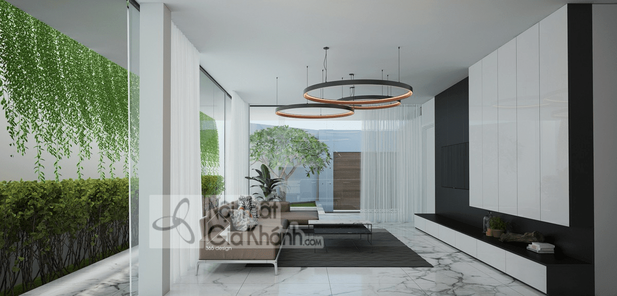Sofa màu nâu phối đen trắng tạo chiều sâu cho phòng khách hiện đại