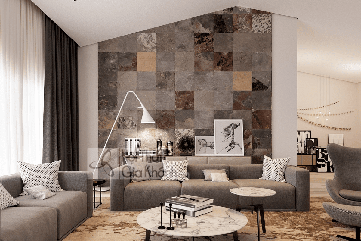 Sofa cỡ lớn màu nâu phối ghế đối lập tạo điểm nhấn cho phòng khách