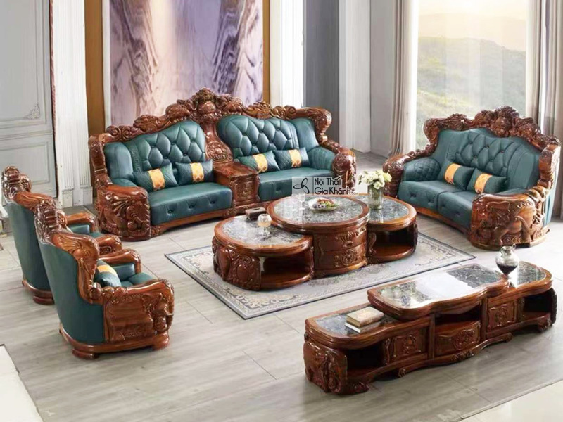 Bộ sofa gỗ Mun tân cổ điển SB05-1124 được chụp từ góc rộng trong không gian phòng khách sang trọng, trưng bày đầy đủ gồm h…