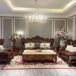 Toàn cảnh bộ sofa tân cổ điển SB998GG-123 màu nâu gỗ và nâu da, được chụp từ góc chính diện trong một phòng khách sang trọ…