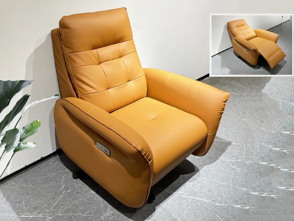 Ghế thư giãn điện E66 màu nâu vàng, chụp từ góc chéo phía trước, đặt trên nền gạch vân đá xám. Ghế có thiết kế hiện đại vớ…