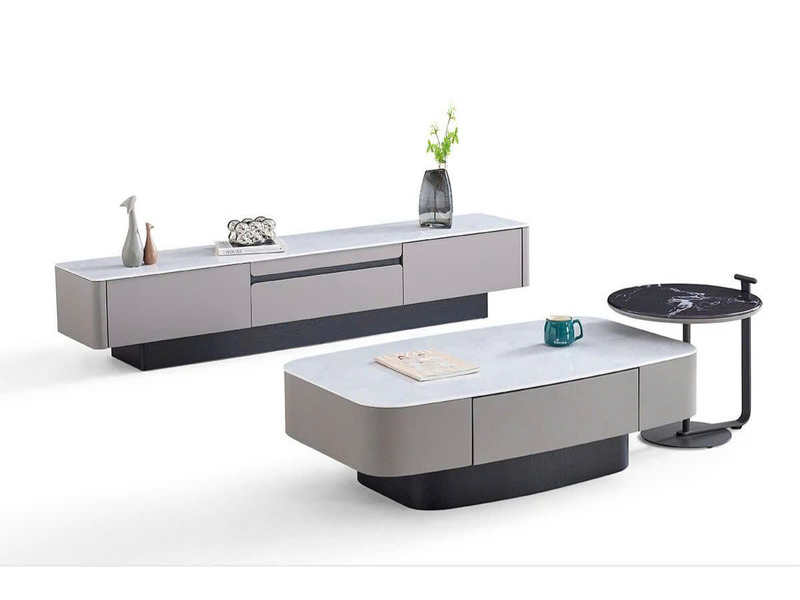 Bàn trà đôi BT6205 hình oval, cùng kệ tivi và bàn phụ tròn, chụp từ góc chếch trên nền trắng. Thiết kế hiện đại với mặt đá…
