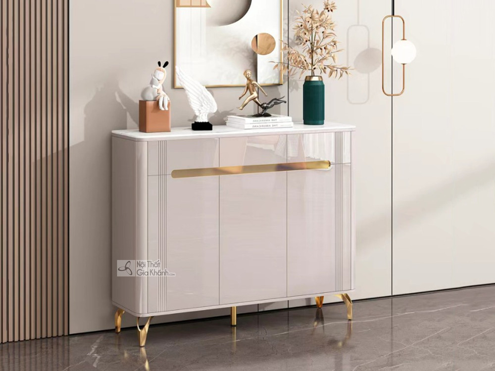Tủ giày hiện đại TDEH166 được chụp chính diện, hơi chếch sang phải, đặt trong không gian sảnh hoặc phòng khách. Tủ có ba c…