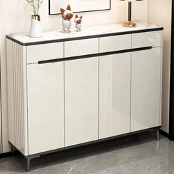 Tủ giầy hiện đại TDHB160 màu trắng bóng, mặt trên ốp đá vân xám, đặt ở lối vào. Tủ có sáu cánh tủ đóng mở và một ngăn kéo…