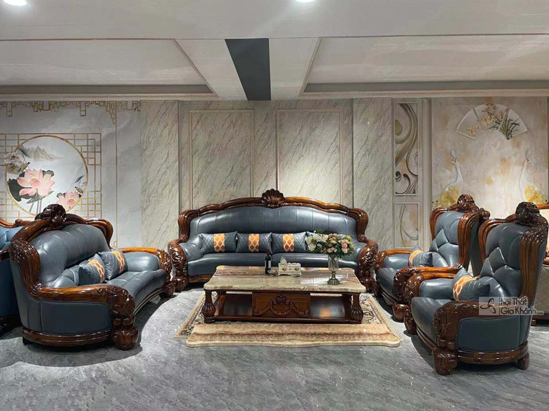 Bộ sofa gỗ Mun vương giả SF03-1124 chụp chính diện, trưng bày trong phòng khách cổ điển. Bộ gồm sofa băng dài, hai sofa đơ…