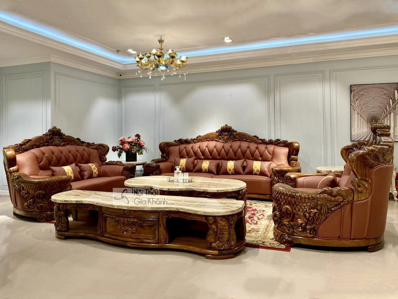 Toàn cảnh bộ sofa tân cổ điển sang trọng với khung gỗ mun Nam Phi chạm khắc tinh xảo, bọc da bò tót màu nâu cam. Bộ sản ph…