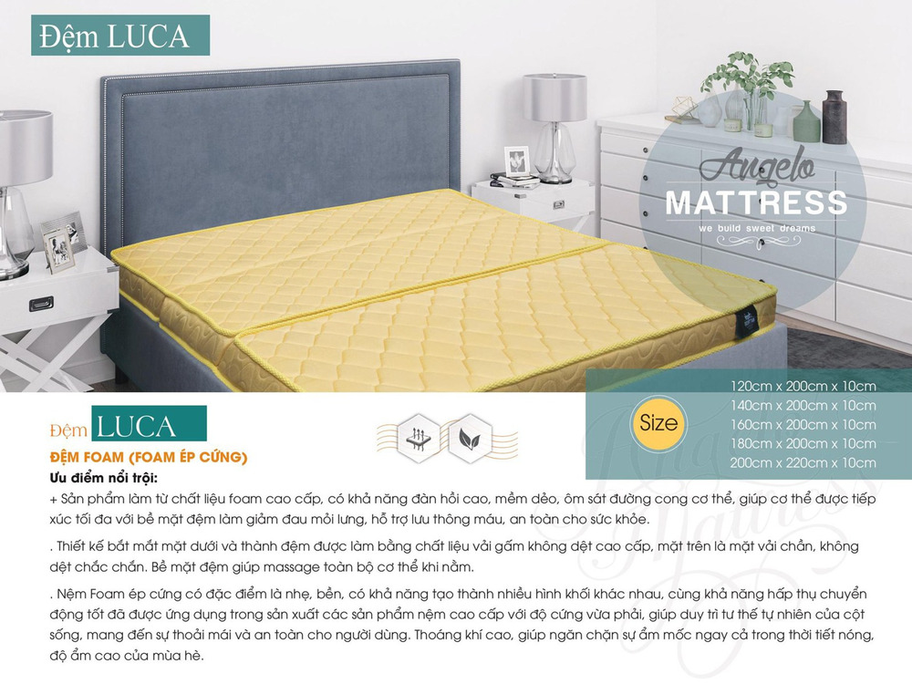 Đệm foam cứng Luca màu vàng nhạt, được đặt gọn gàng trên một chiếc giường bọc vải màu xám hiện đại. Góc chụp ngang, cận cả…
