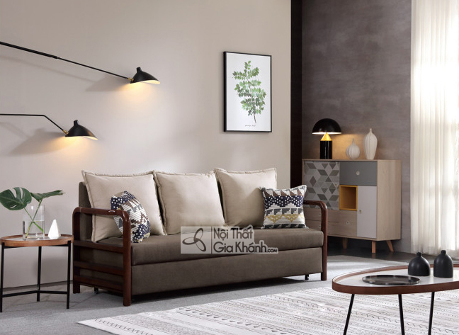 Sofa giường băng 3 SF273A-8G chụp góc chếch trong phòng khách hiện đại. Sofa có khung gỗ nâu sẫm lộ ở tay vịn và chân, bọc…