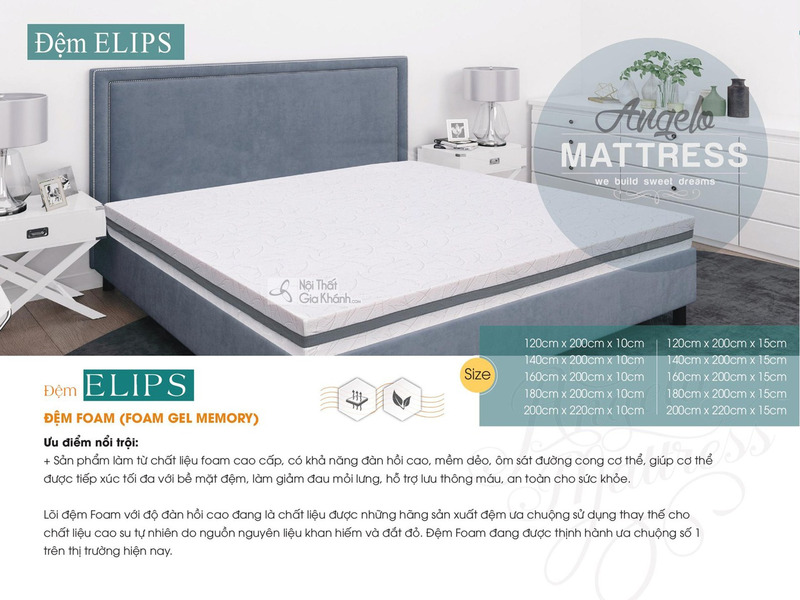 Đệm Foam Gel Memory Elips được đặt gọn gàng trên một chiếc giường bọc vải màu xám đậm, chụp từ góc hơi chếch phía trên. Bề…