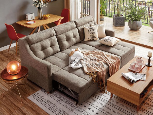 Sofa góc chữ U thông minh bọc vải màu ghi be, đặt trong không gian phòng khách hiện đại. Sofa có tựa lưng rút múi và đệm n…