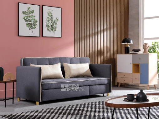Ghế sofa đa năng SF1018-3 bọc vải màu xám, nhìn từ góc hơi chếch bên phải, đặt trong không gian phòng khách hiện đại. Sofa…