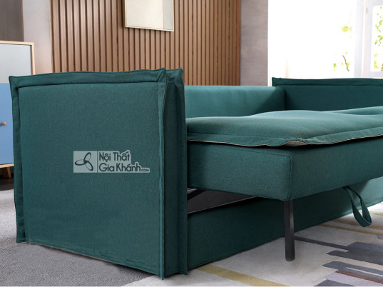 Cận cảnh chi tiết phần chân và cơ chế kéo ra của sofa giường màu xanh ngọc bích, cho thấy khả năng biến đổi thành giường…