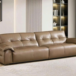 Ảnh chụp toàn cảnh sofa băng SFB8166 màu nâu be đặt trong không gian phòng khách hiện đại. Sofa có thiết kế tối giản với t…
