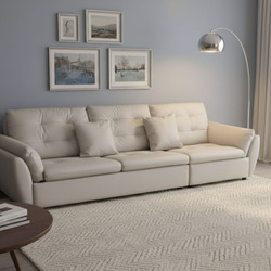 Sofa băng 2m8 SFA07-28 màu be nhạt, chụp góc ngang trong không gian phòng khách hiện đại. Sofa có ba đệm ngồi và ba tựa lư…