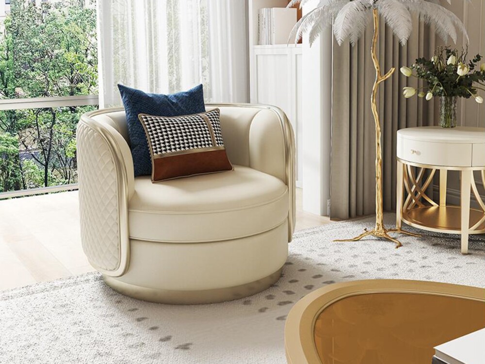Ghế sofa đơn xoay tròn màu kem sang trọng, bọc da/vải cao cấp với chi tiết chần trám ở lưng ghế và tay vịn bo tròn. Chân g…