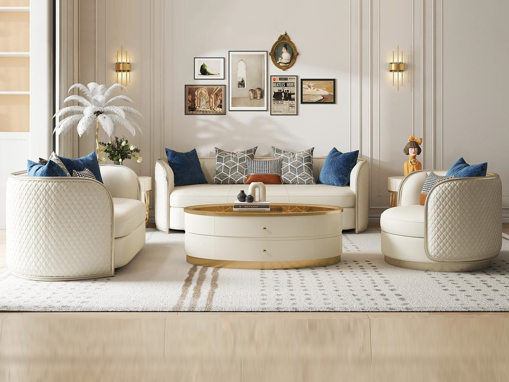 Bộ sofa phòng khách phong cách Mỹ luxury gồm một sofa băng dài và hai ghế đơn, bọc da/vải màu kem sang trọng. Ghế có tựa l…