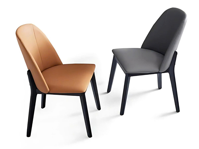 Hai chiếc ghế ăn hiện đại GA888 được chụp từ góc hơi nghiêng, một chiếc màu nâu da bò và một chiếc màu xám, nổi bật trên n…