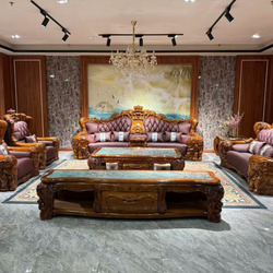 Bộ sofa gỗ Mun nhập khẩu GM2220-1125 được chụp toàn cảnh từ phía trước, trưng bày trong không gian phòng khách sang trọng…
