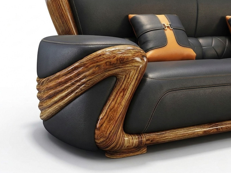 Cận cảnh tay vịn của một chiếc sofa trong bộ SBF532-125, nổi bật với đường cong mềm mại, bọc da bò màu đen và ốp gỗ mun vâ…