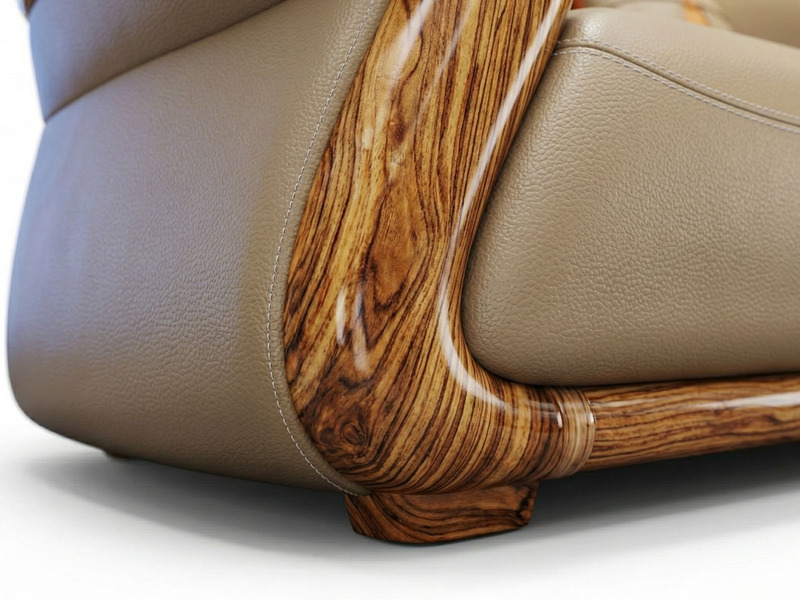 Cận cảnh phần chân và tay vịn của sofa, cho thấy rõ chi tiết khung gỗ Mun tự nhiên với vân gỗ độc đáo, được đánh bóng tỉ m…