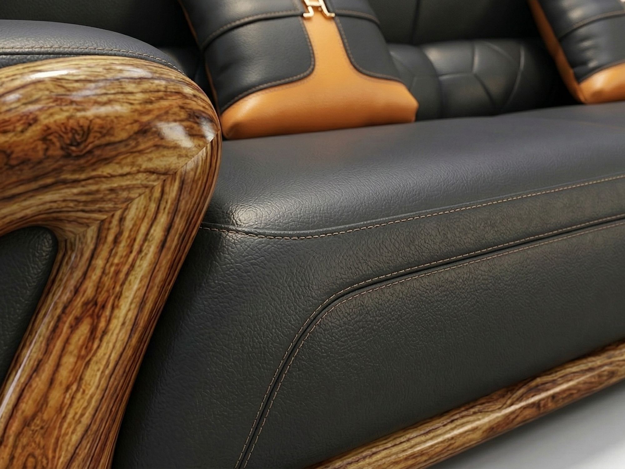Cận cảnh bề mặt đệm ngồi và phần chân của sofa, cho thấy chất liệu da bò màu đen với đường may nổi bật, tạo sự chắc chắn v…