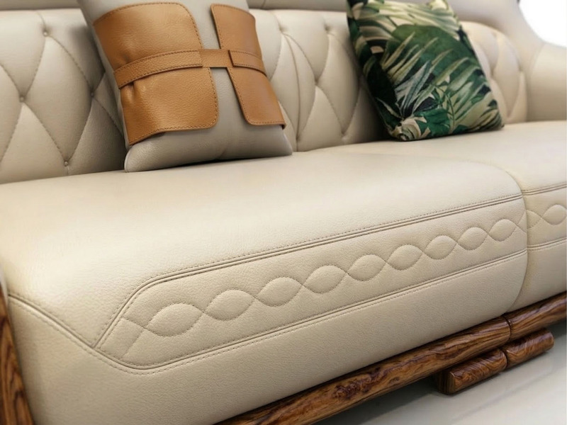 Cận cảnh phần đệm ngồi và tựa lưng của ghế sofa trong bộ SB8103-124. Đệm ngồi bọc da bò màu kem với đường may họa tiết hìn…