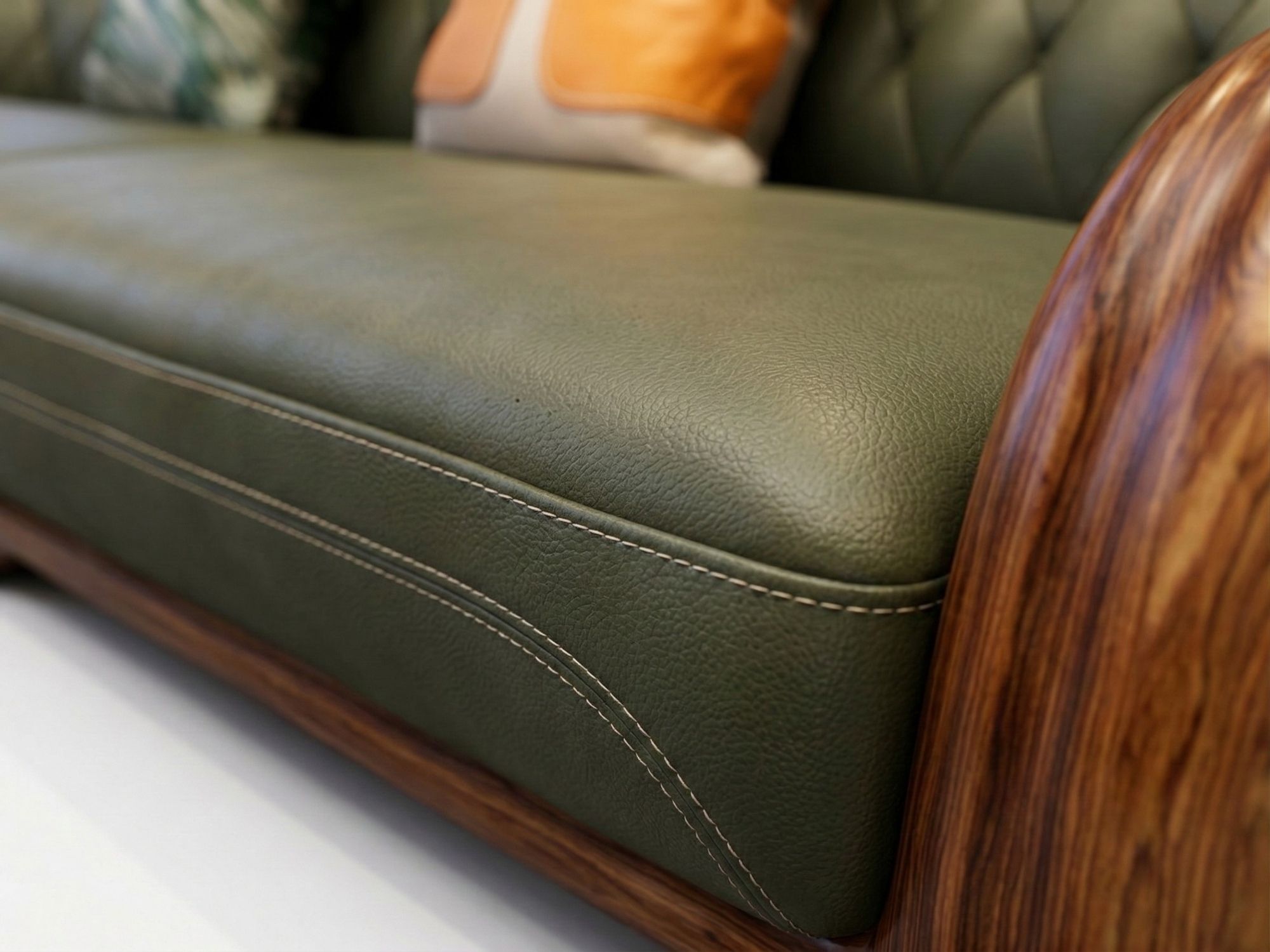 Chi tiết đường may kép tinh xảo trên bề mặt da bò tự nhiên màu xanh rêu của đệm sofa SBD56-1125. Góc chụp cận cảnh này làm…