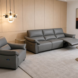Bộ sofa băng điện SF-B8179-13 màu xám đậm, gồm ghế đơn và băng ba chỗ, được chụp từ góc nhìn rộng trong không gian phòng k…