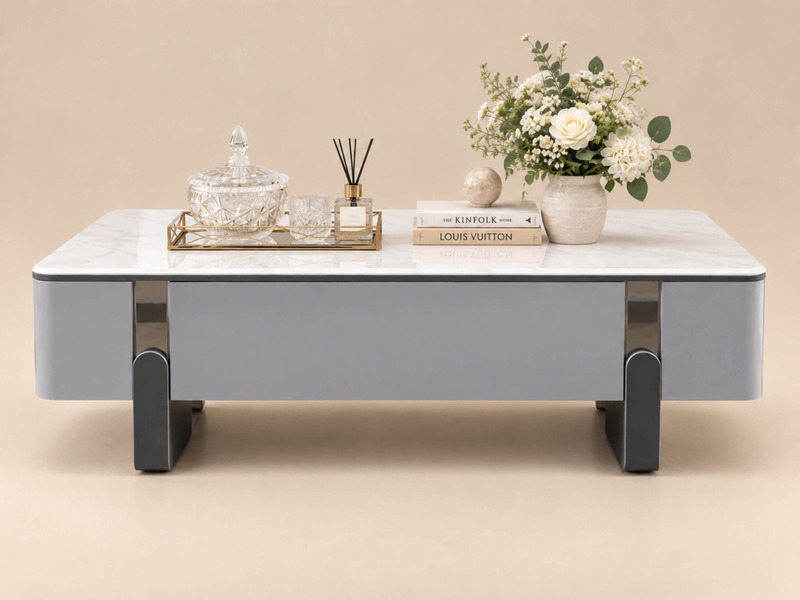 Bàn trà LUNA BT6209-14 nhìn trực diện từ trên xuống, thể hiện rõ mặt đá vi tinh thể trắng vân mây và thân bàn màu xám nhạt…