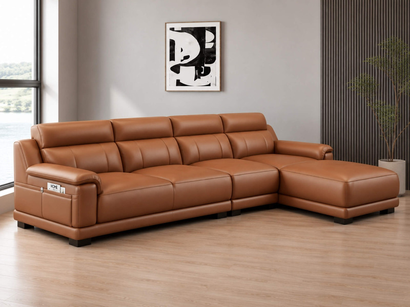 Sofa góc L VENTO màu nâu caramel, chụp từ góc chếch bên phải, tập trung vào phần góc L và tay vịn bên phải. Tay vịn tích h…